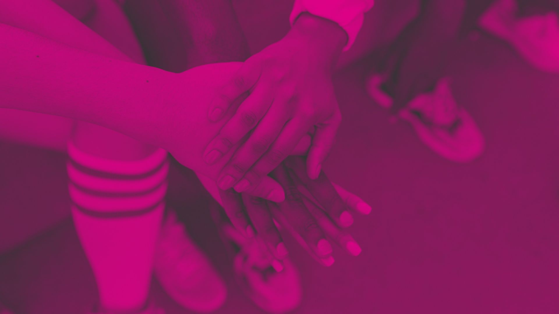 An image of hands on top of one another in a show of solidarity - funding to provide support for disadvantaged children and their families, especially in the cost of living crisis.