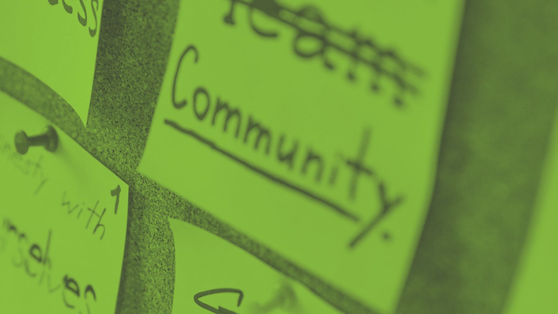 Image of a pinboard with the word community on it - Ford Britain Trust local community grants